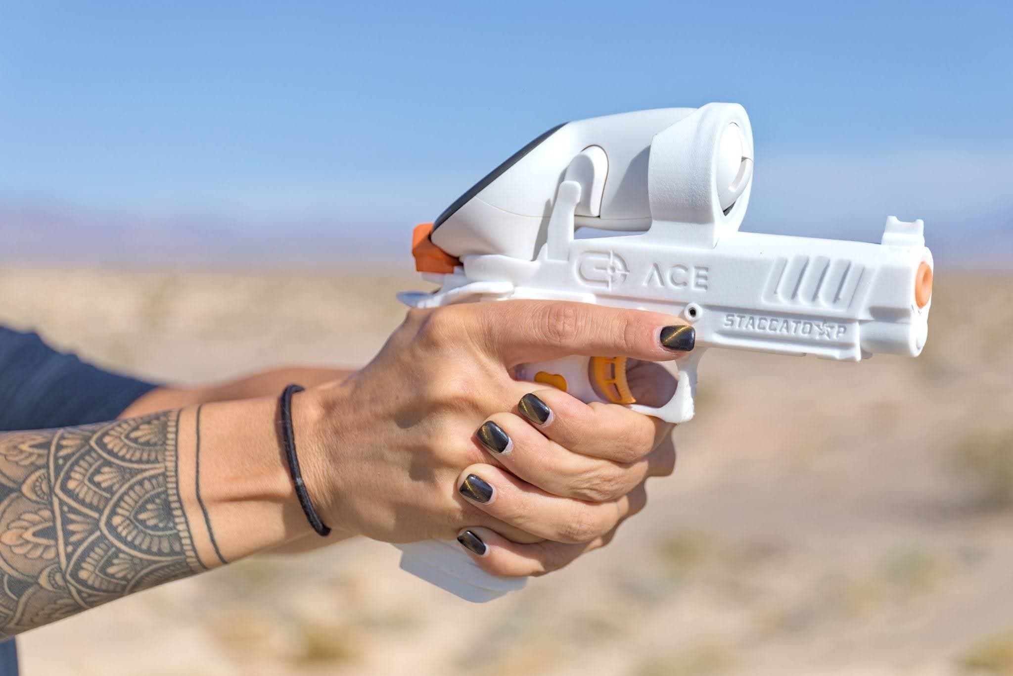 Close-up of a handgun peripheral molded to OEM-licensed production geometry.