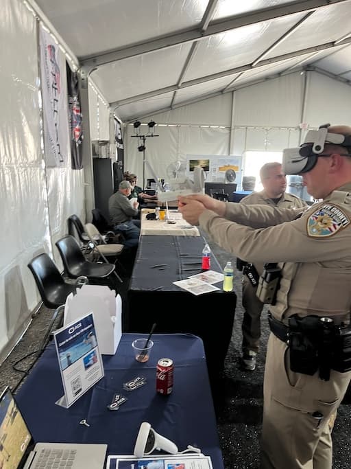Law enforcement trainee in uniform using Ace VR handgun training.